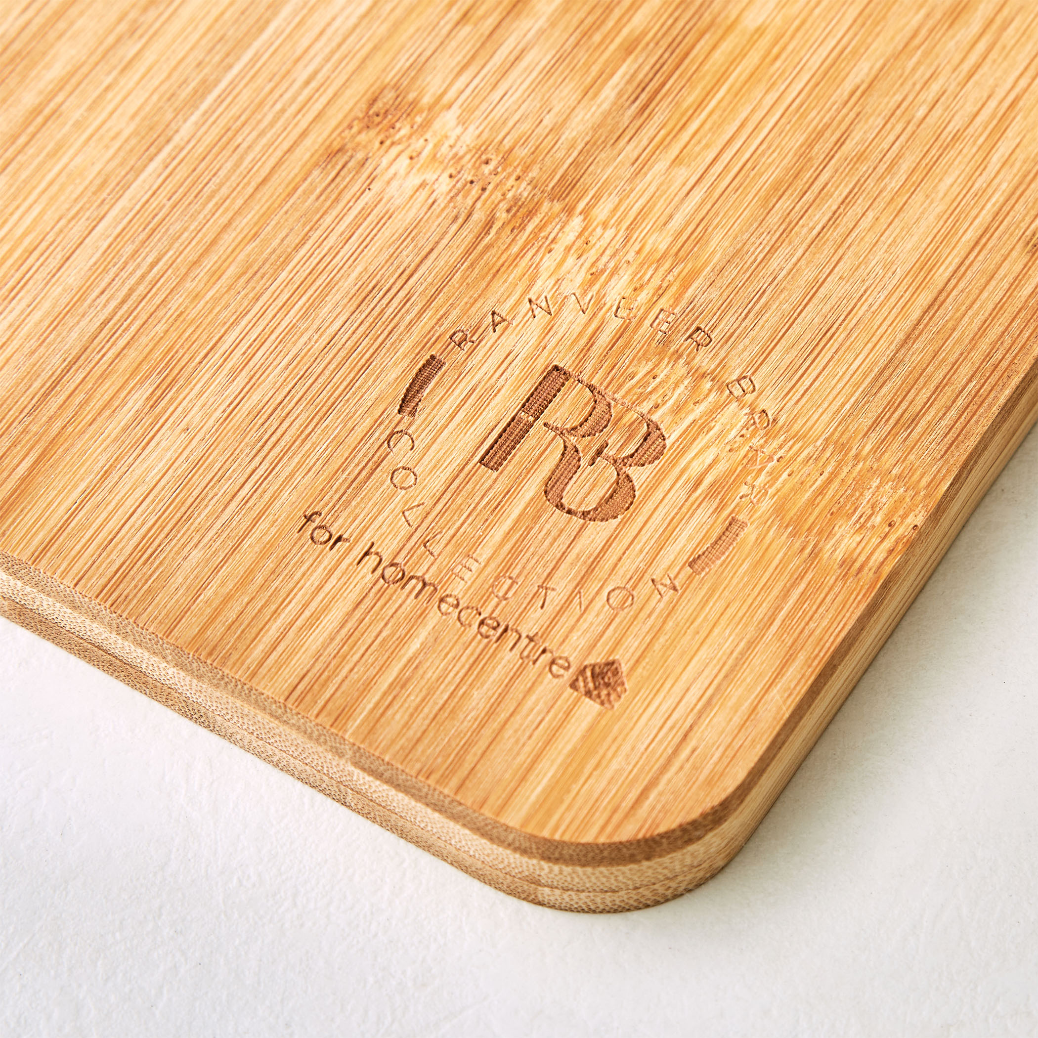 Chef Cubis Edulis Bamboo Chopping Board with Handle in Brown